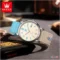 olevs-canvas-watch-red-white-strap-handheld